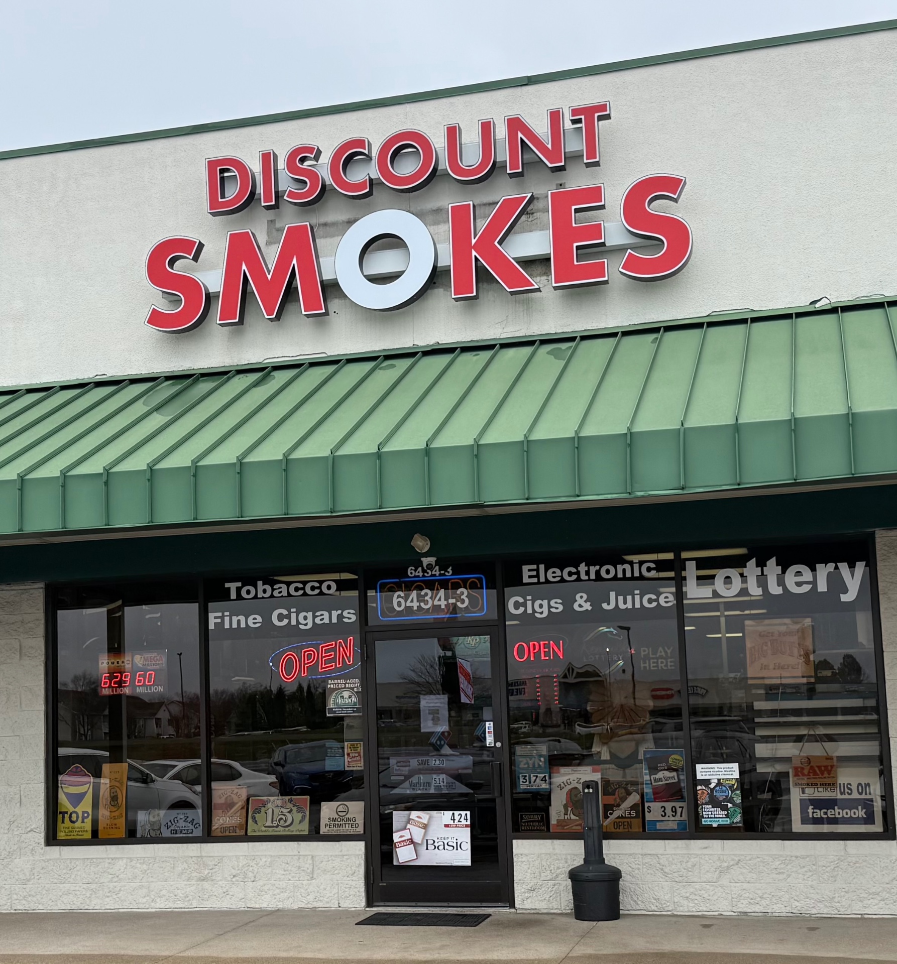 Discount Smokes storefront on Preston Highway Louisville KY - Tobacco, Fine Cigars, Electronic Cigs, Vapes and Lottery